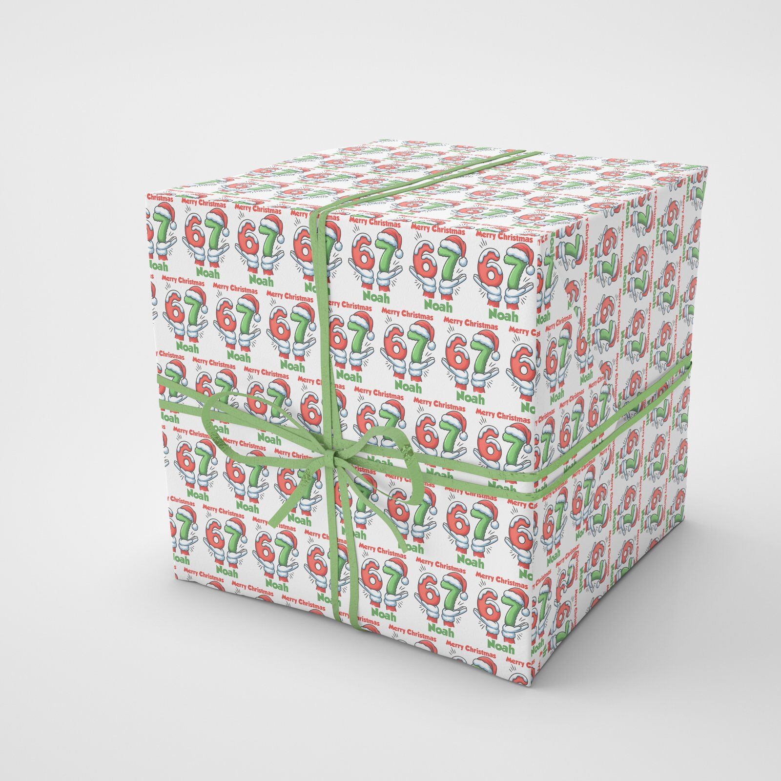 Wrapped Christmas presents using personalised 67 meme wrapping paper, featuring custom name and festive illustrated number design.